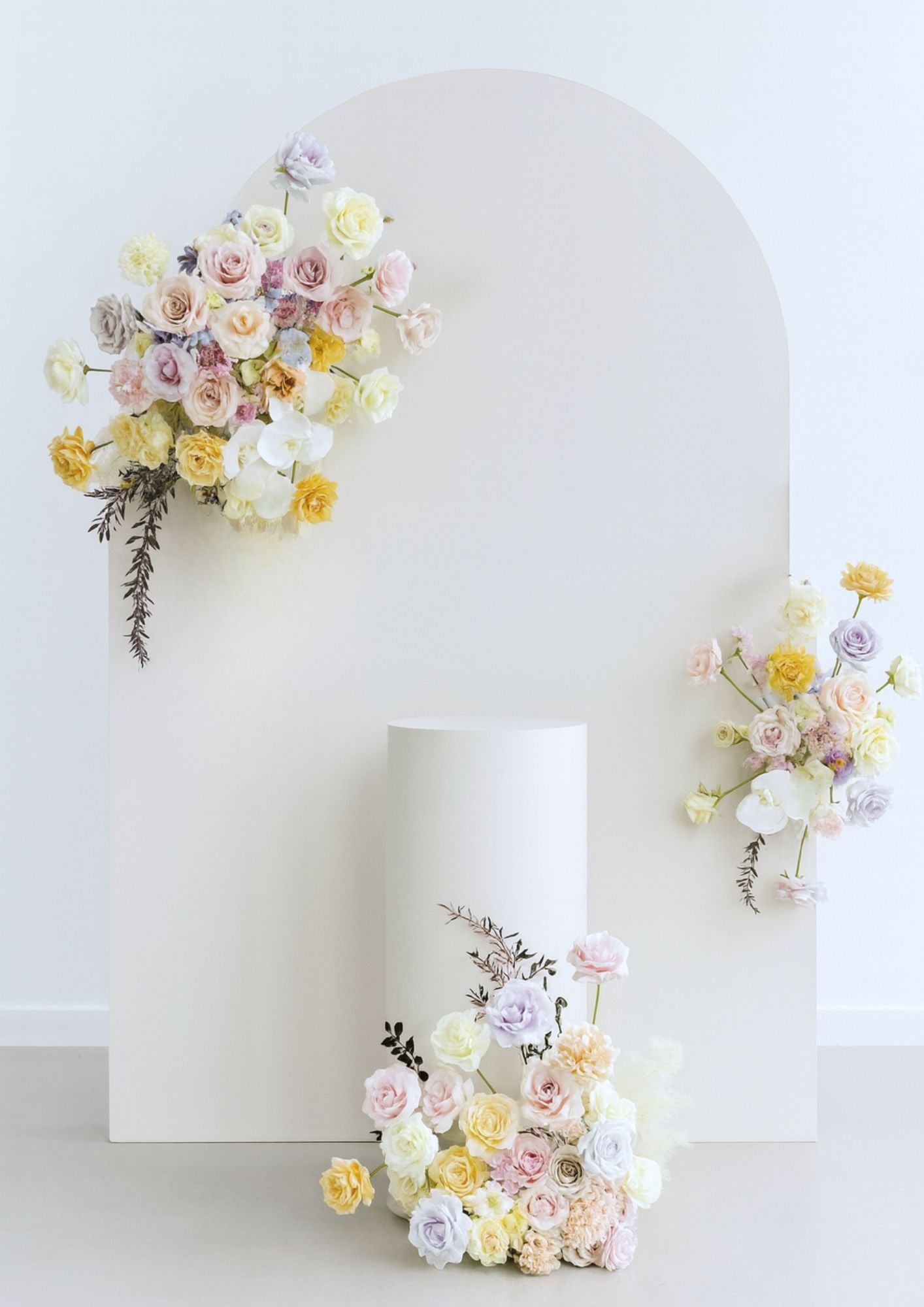 Plain arch backdrop with floral accents.
