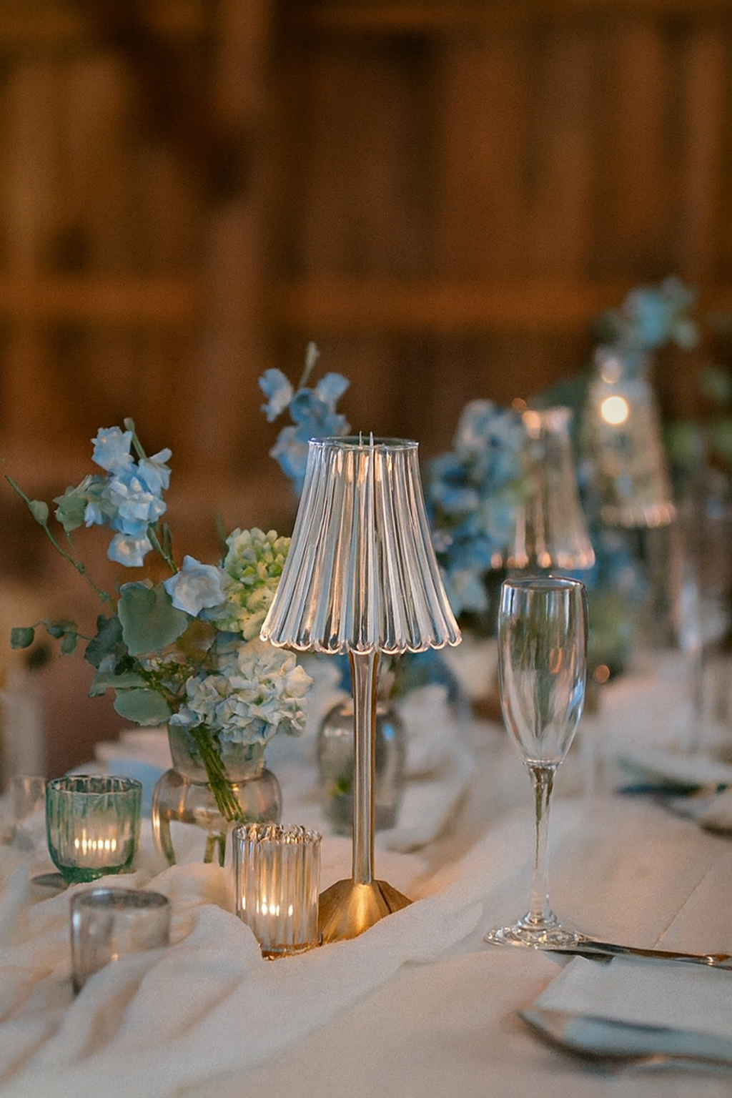Decorative table setting with a wireless lamp, flowers.