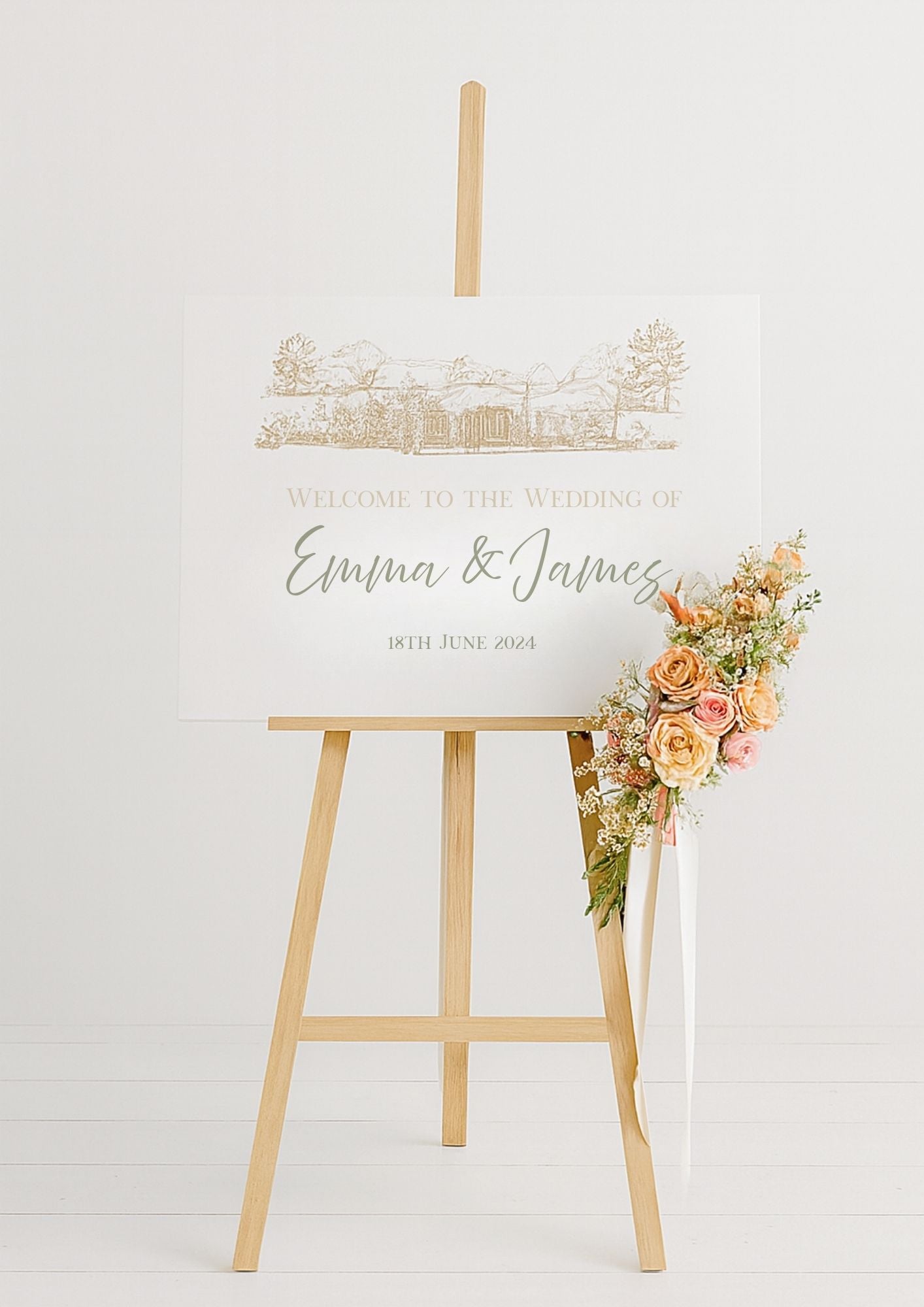 Welcome sign with wedding venue illustration on a wooden stand, adorned with flowers.