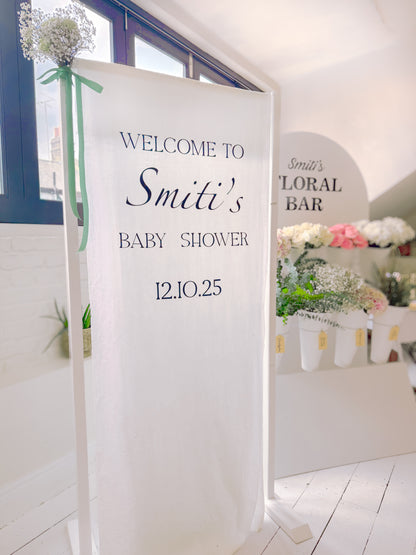 A premiunm fabric sign welcoming guests